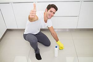 Man cleaning porcelain floor